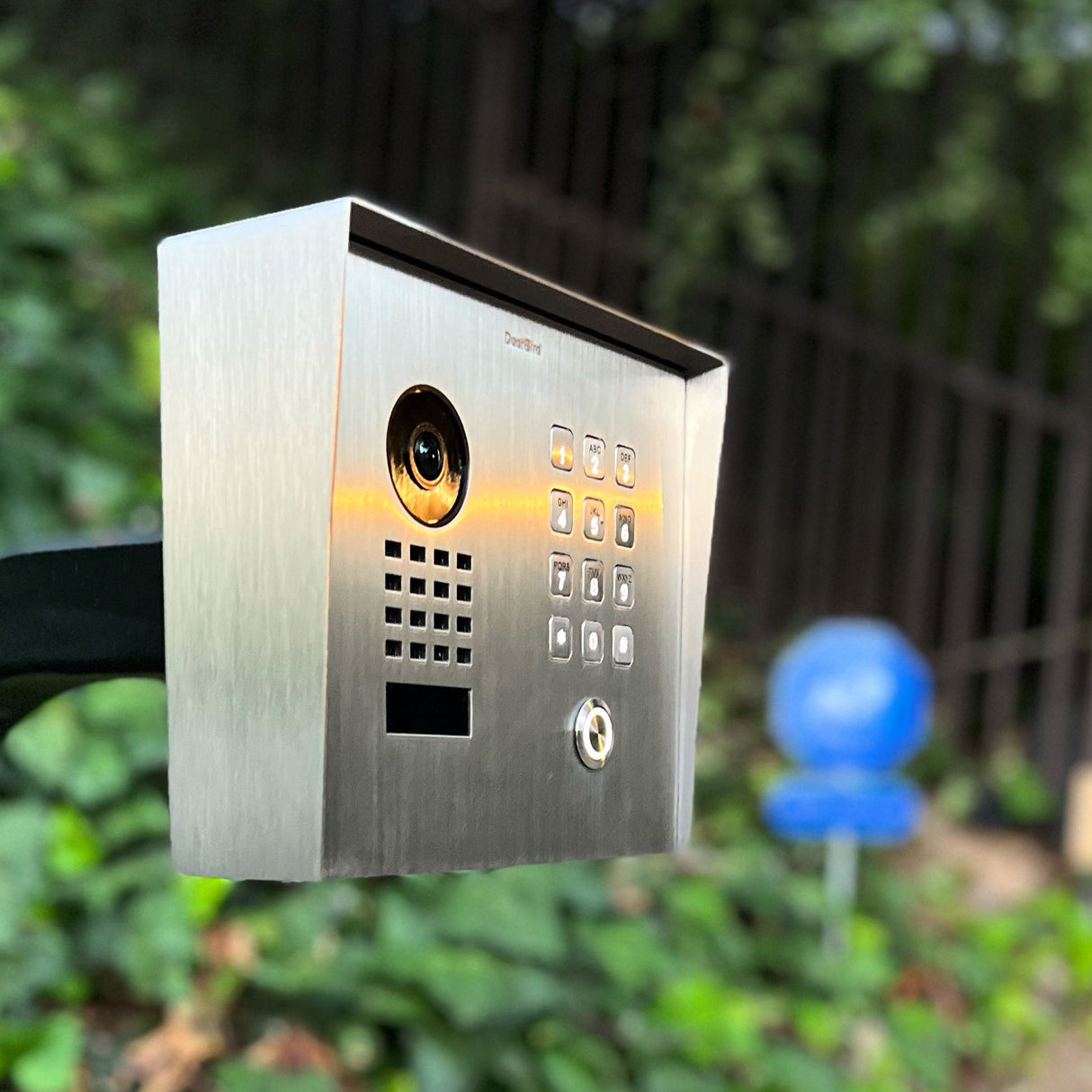 DoorBird D1101KH Smart Intercom System shown on a gooseneck post