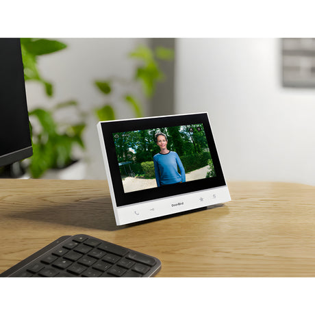 DoorBird A1103 WiFi IP Video Indoor Station, White Edition on a desk | Elitegates.net