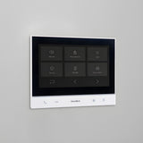 DoorBird A1103 WiFi IP Video Indoor Station, White Edition mounted on a wall | Elitegates.net