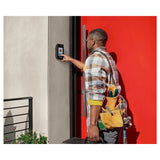 Delivery man using the Liftmaster CAPXS that is mounted on the wall by the front door