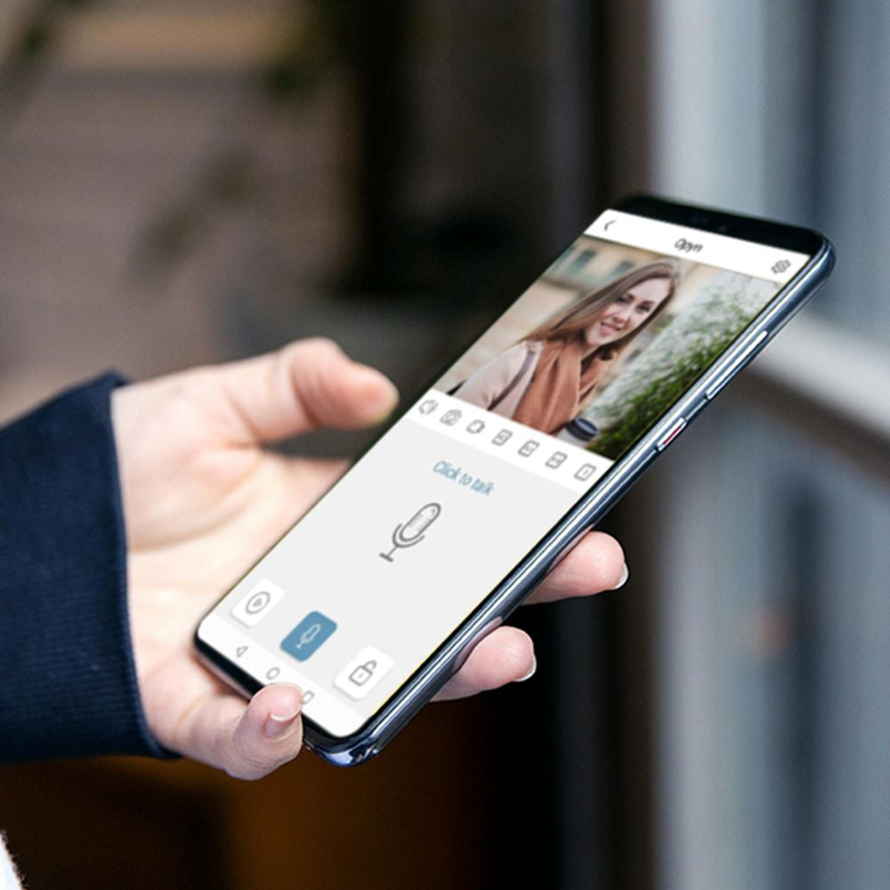 OPYN Video Intercom app (shown a person holding the phone)